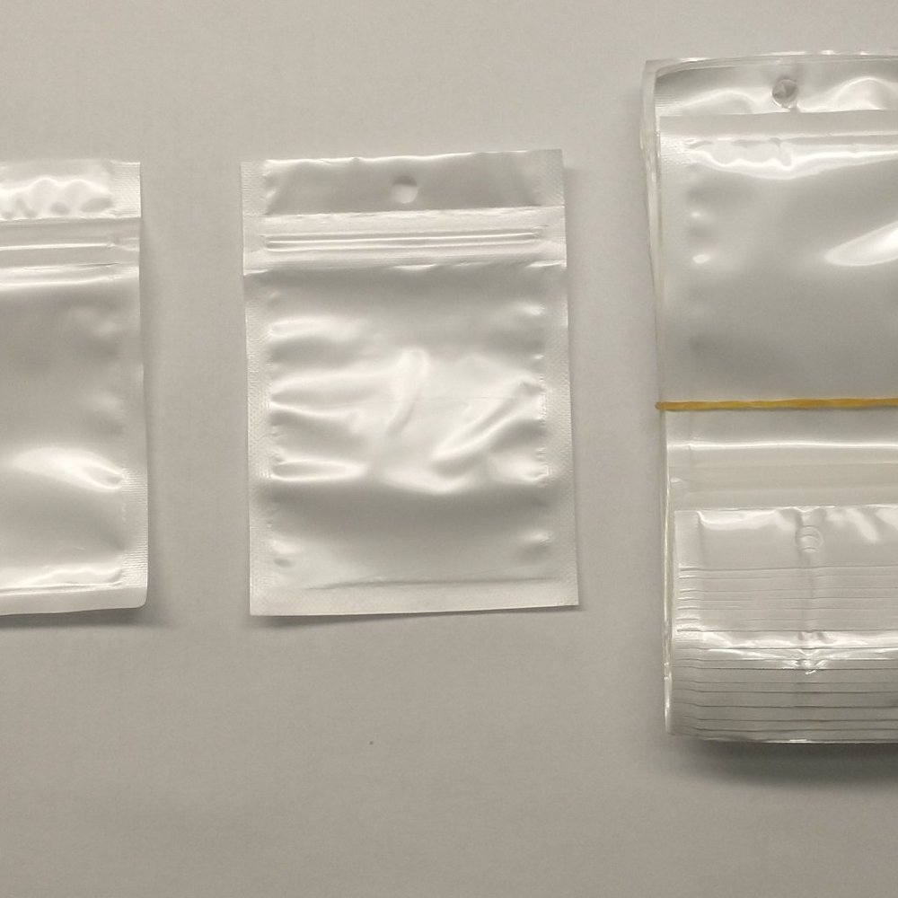 1000 small Zipperlock Plastic Jewelry BAGS - Clear one side & White on the other
